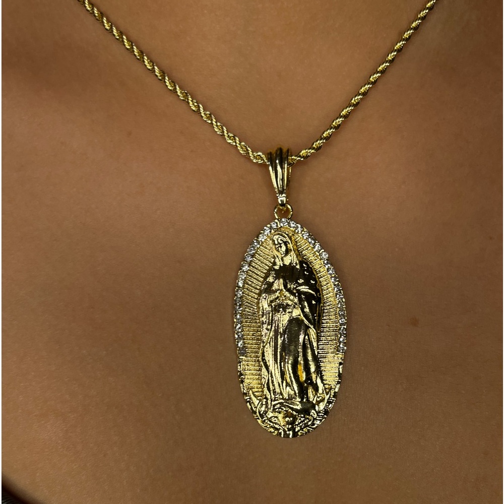 Brand new gold Virgin Mary necklace with clear stones.